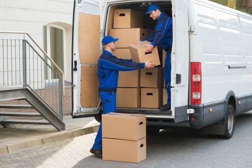Loading furniture and boxes into a van for Shepherdsbush removals