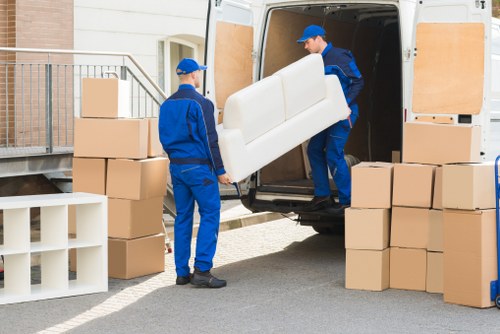 Packed moving boxes and furniture prepared for a Shepherdsbush house move