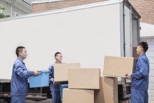 Careful loading of home belongings for transport in West London