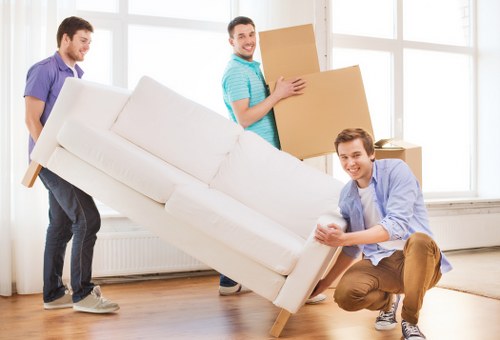 Removal crew handling furniture and storage items