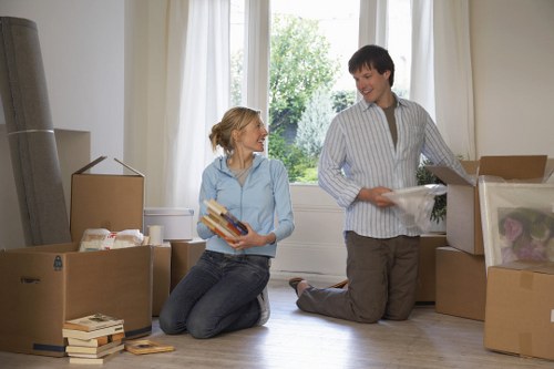 House movers carrying furniture through a London property