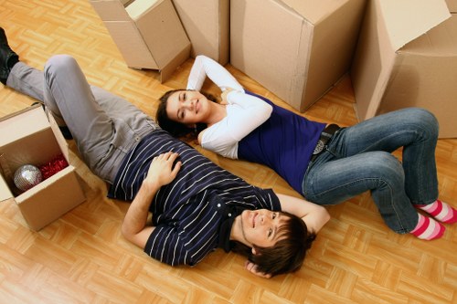 Business relocation team handling desks and IT equipment
