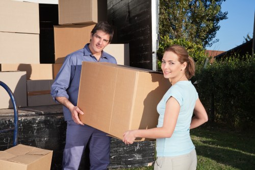 Loading furniture into a removals van on a Shepherdsbush street